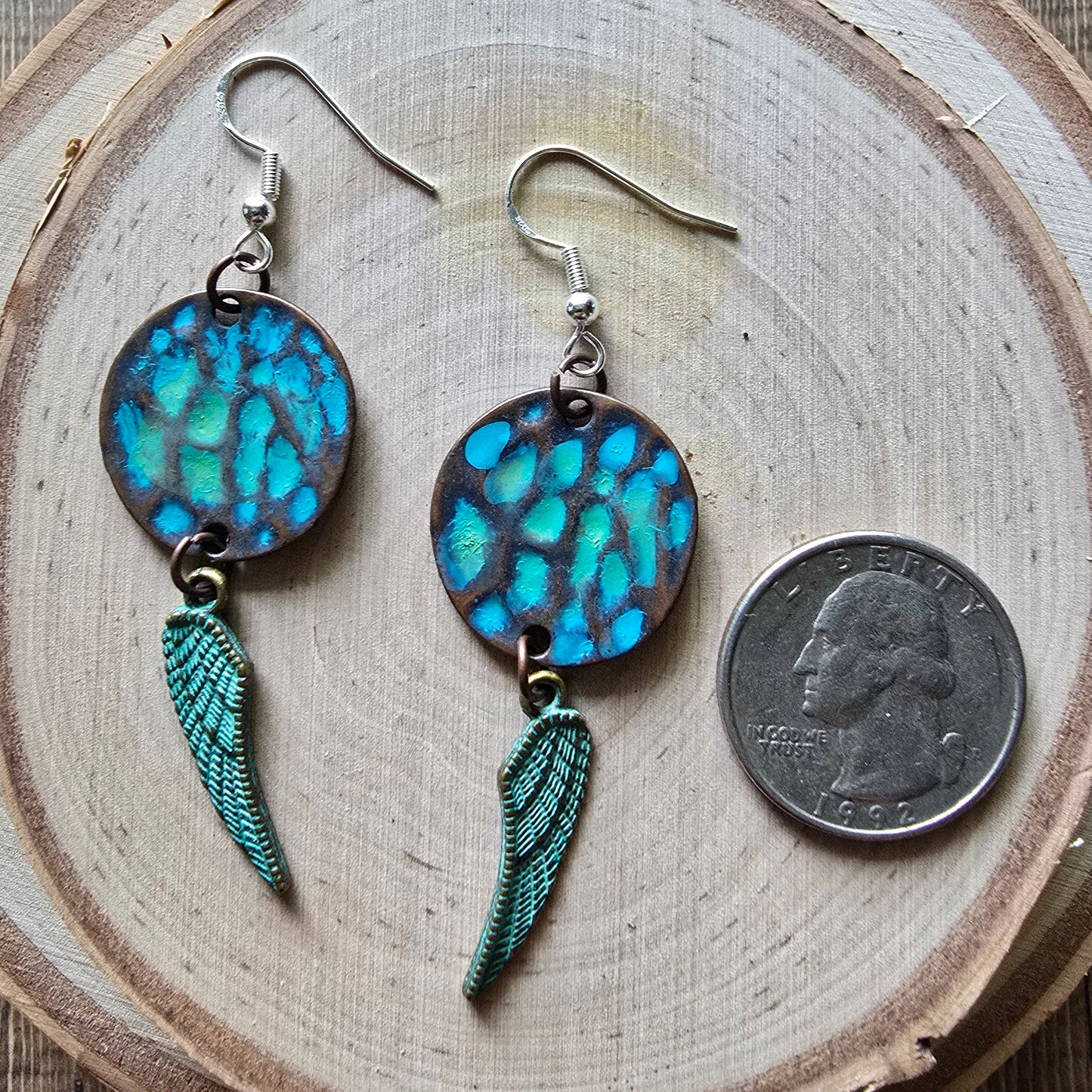 Patina metal disc and angel wing dangle earrings