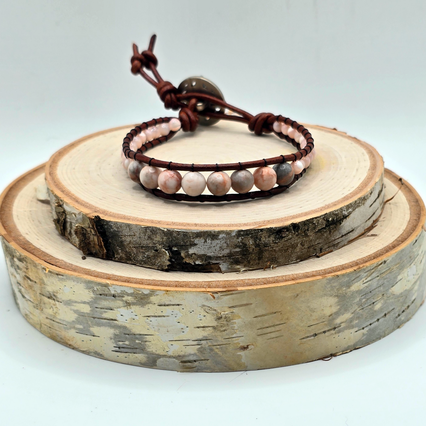 Zebra jasper and mother of pearl graduated single wrap leather bracelet