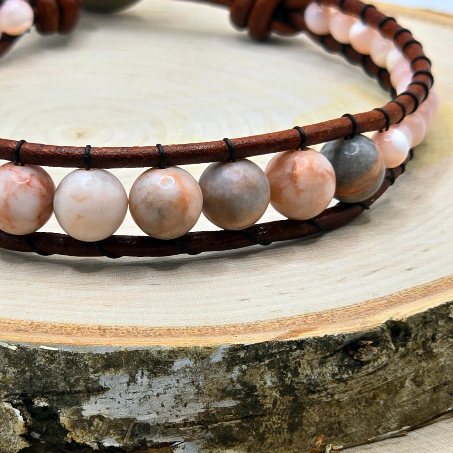 Zebra jasper and mother of pearl graduated single wrap leather bracelet