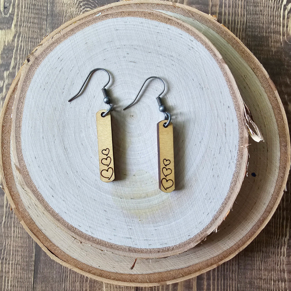 Rectangular wood earrings with engraved hearts