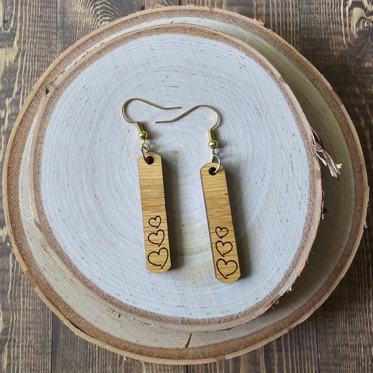 Rectangular wood earrings with engraved hearts