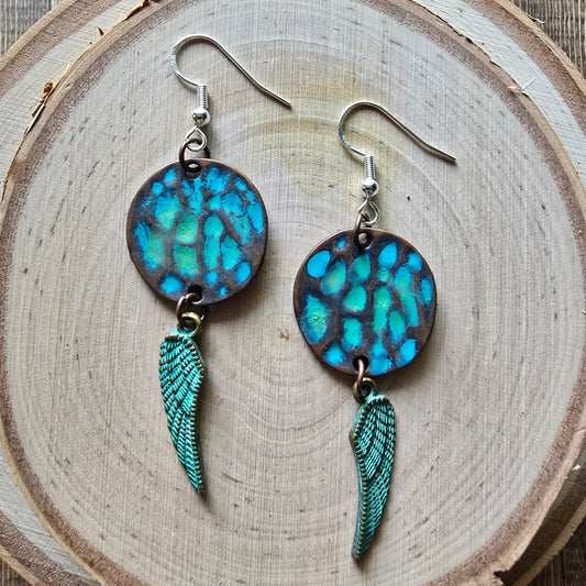Patina metal disc and angel wing dangle earrings