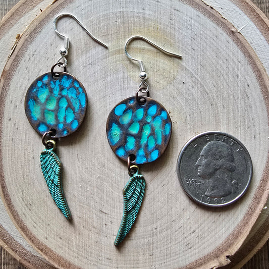 Patina metal disc and angel wing dangle earrings