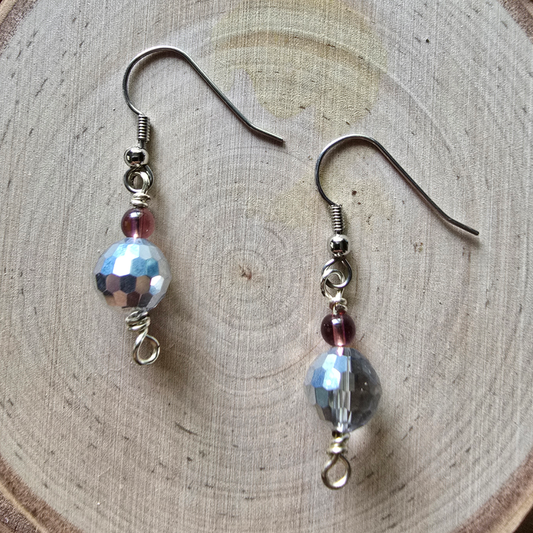 Faceted glass and purple iridescent dangle earrings