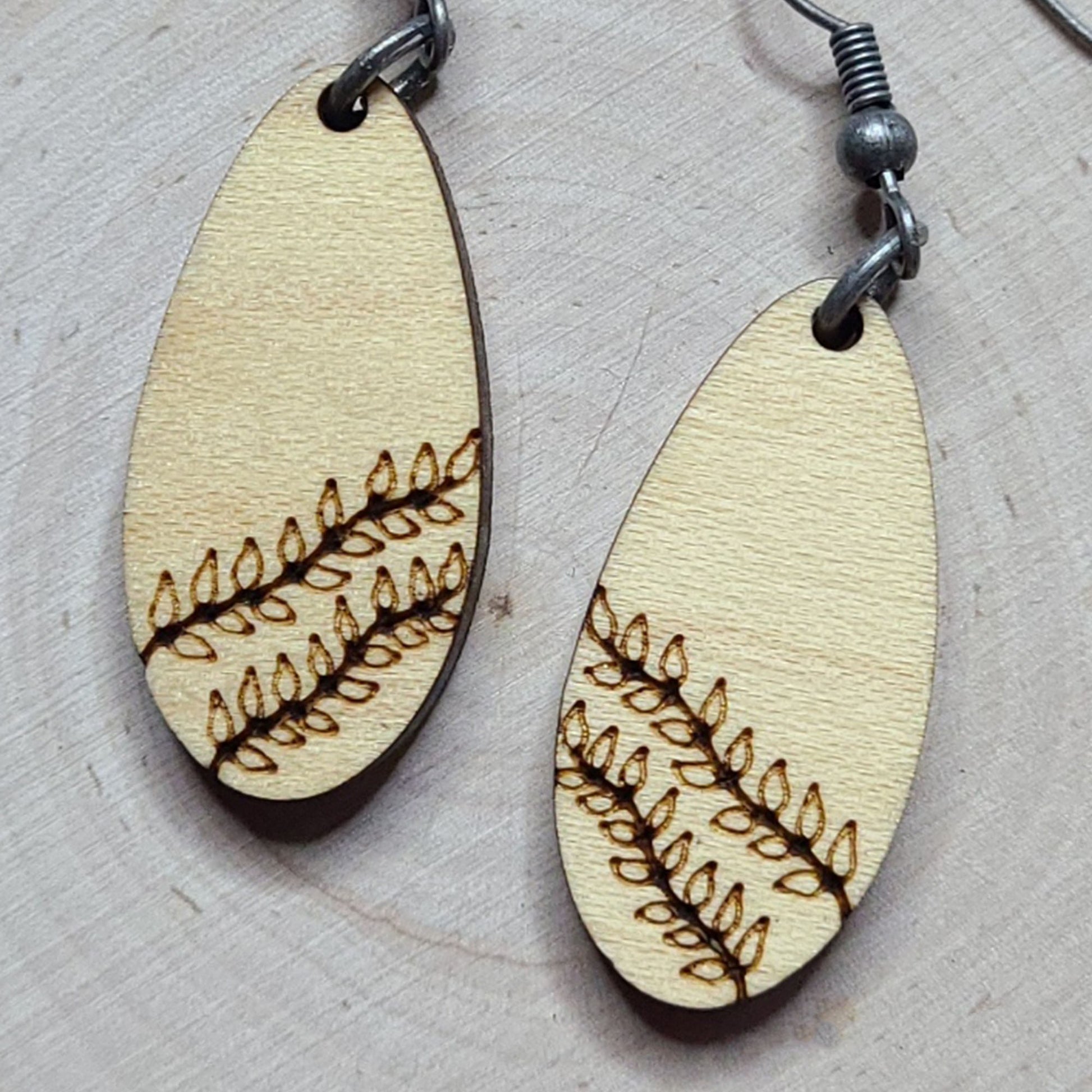 Maple plywood elongated teardrop vine engraved dangle earrings