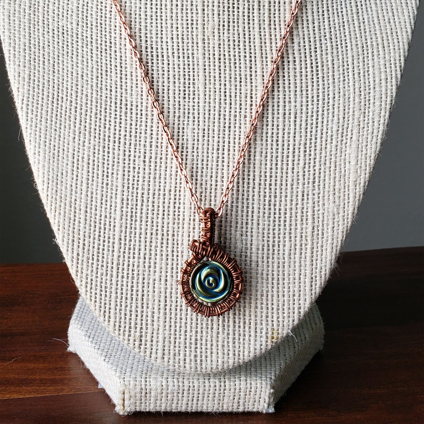 Copper wire wrapped necklace with iris hematite bead