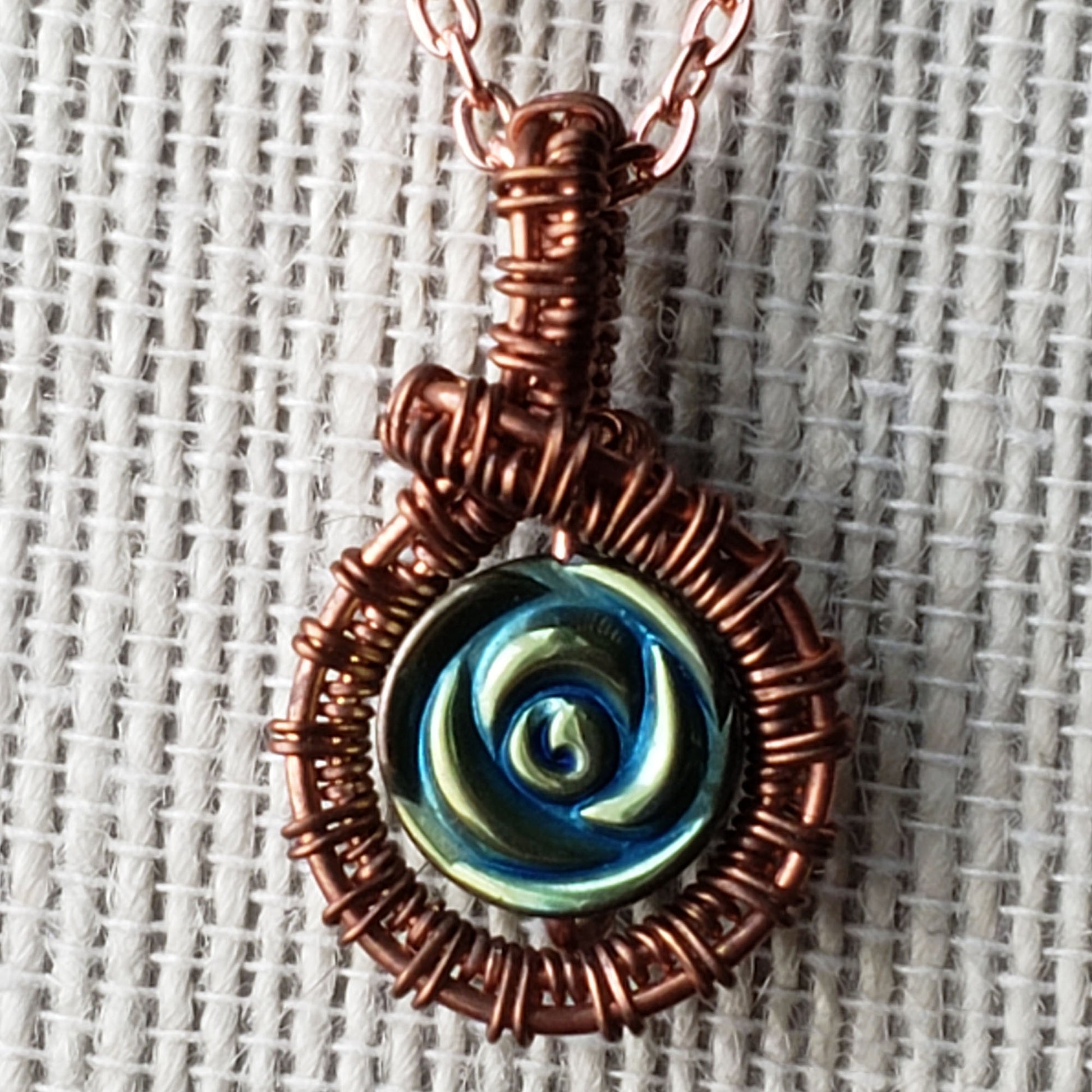 Copper wire wrapped necklace with iris hematite bead