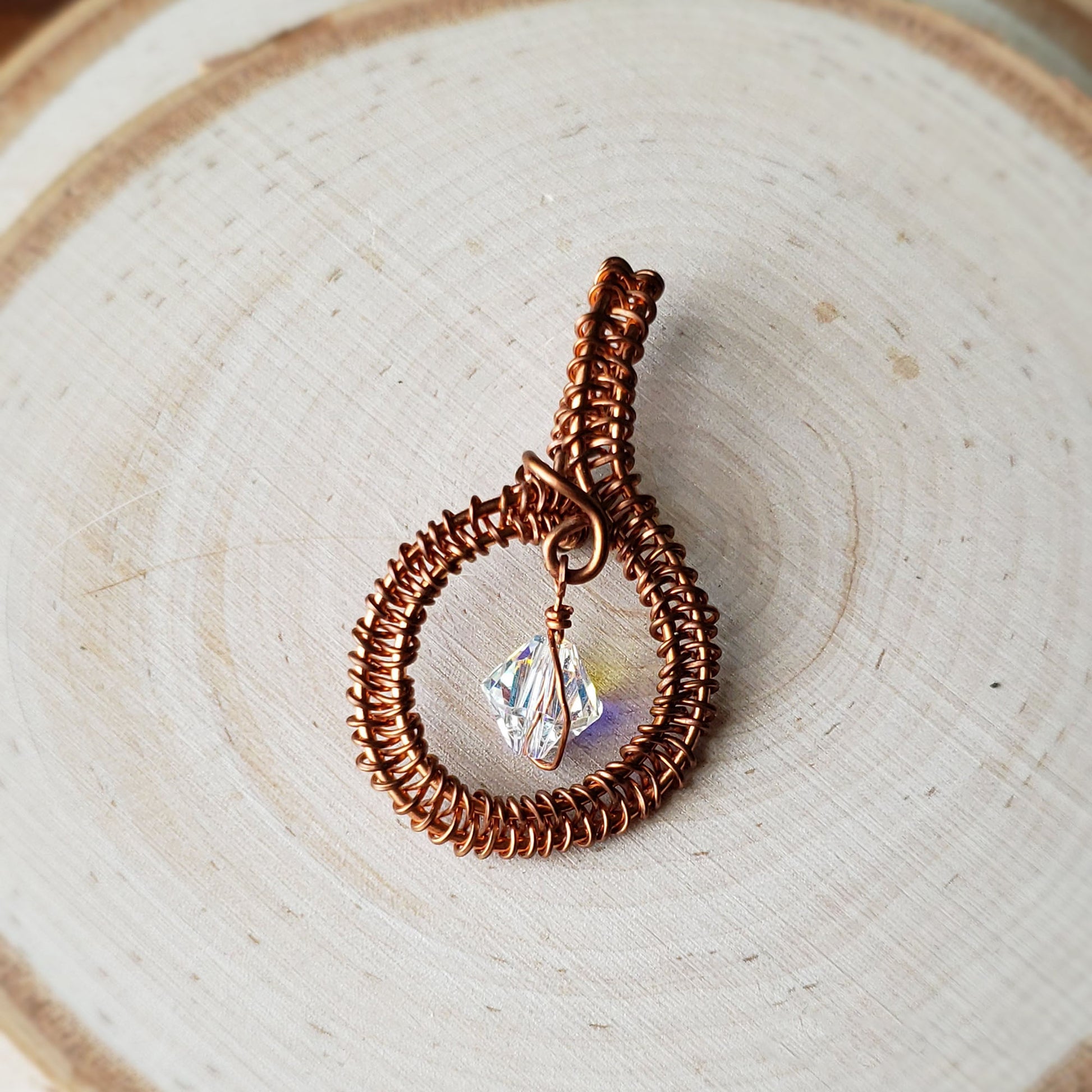 Round copper pendant with clear Swarovski crystal accent bead