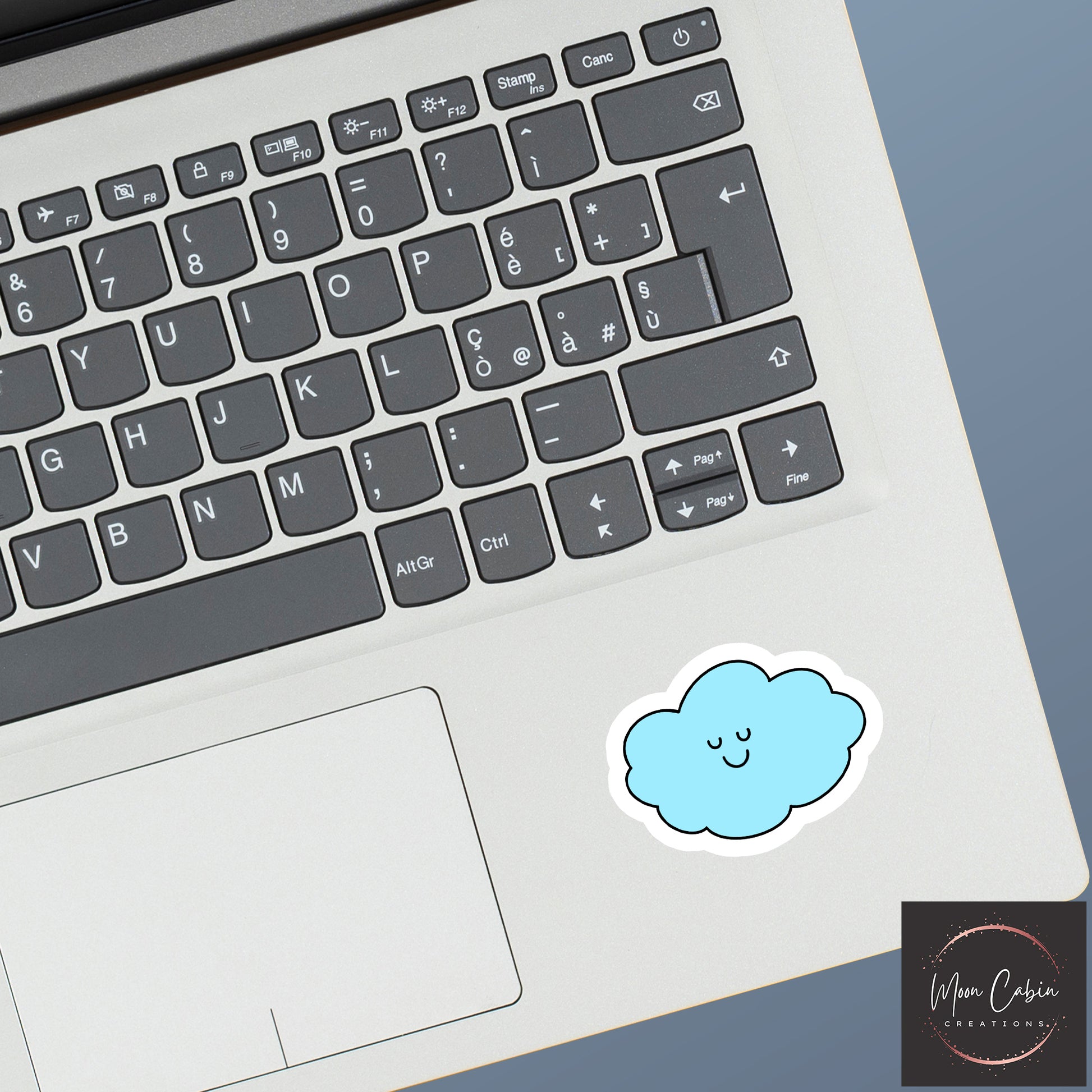 Happy little cloud vinyl sticker, on laptop